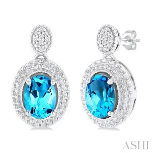 1/20 ctw Oval Cut 7X5 MM Blue Topaz and Round Cut Diamond Semi Precious Earring in Sterling Silver