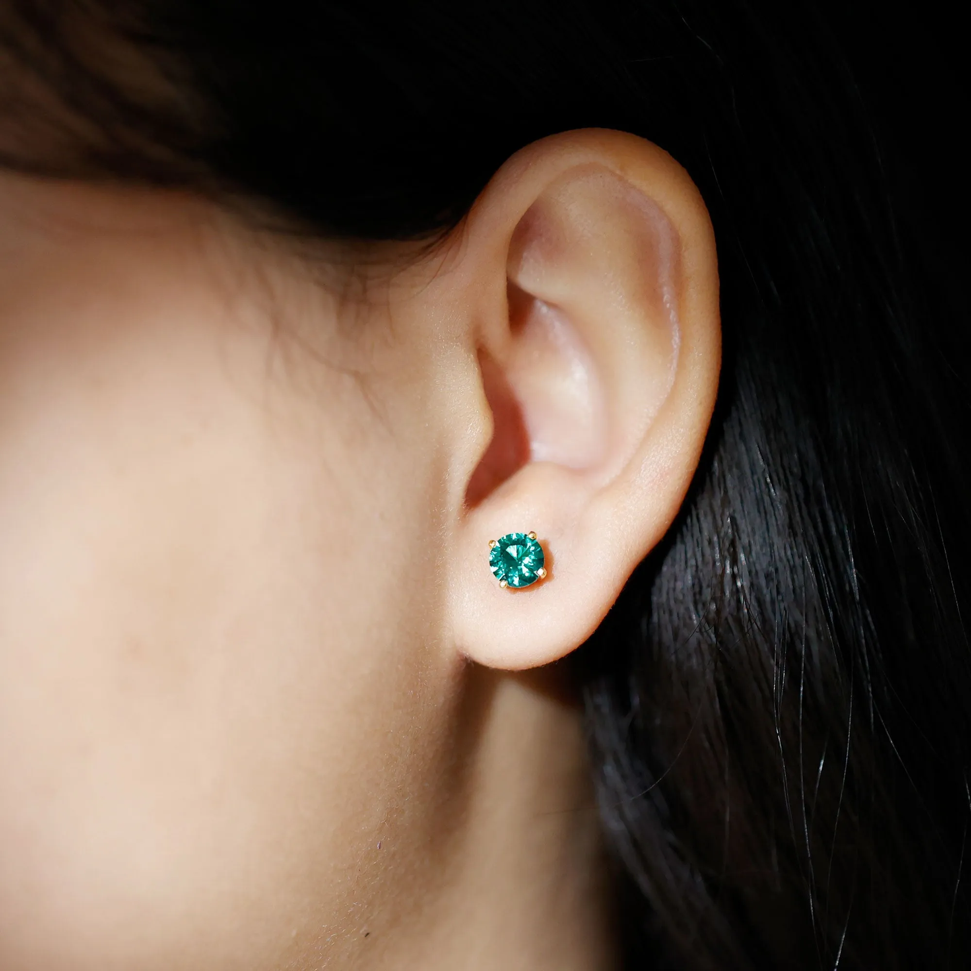 Elegant Created Emerald Solitaire Stud Earrings in Gold