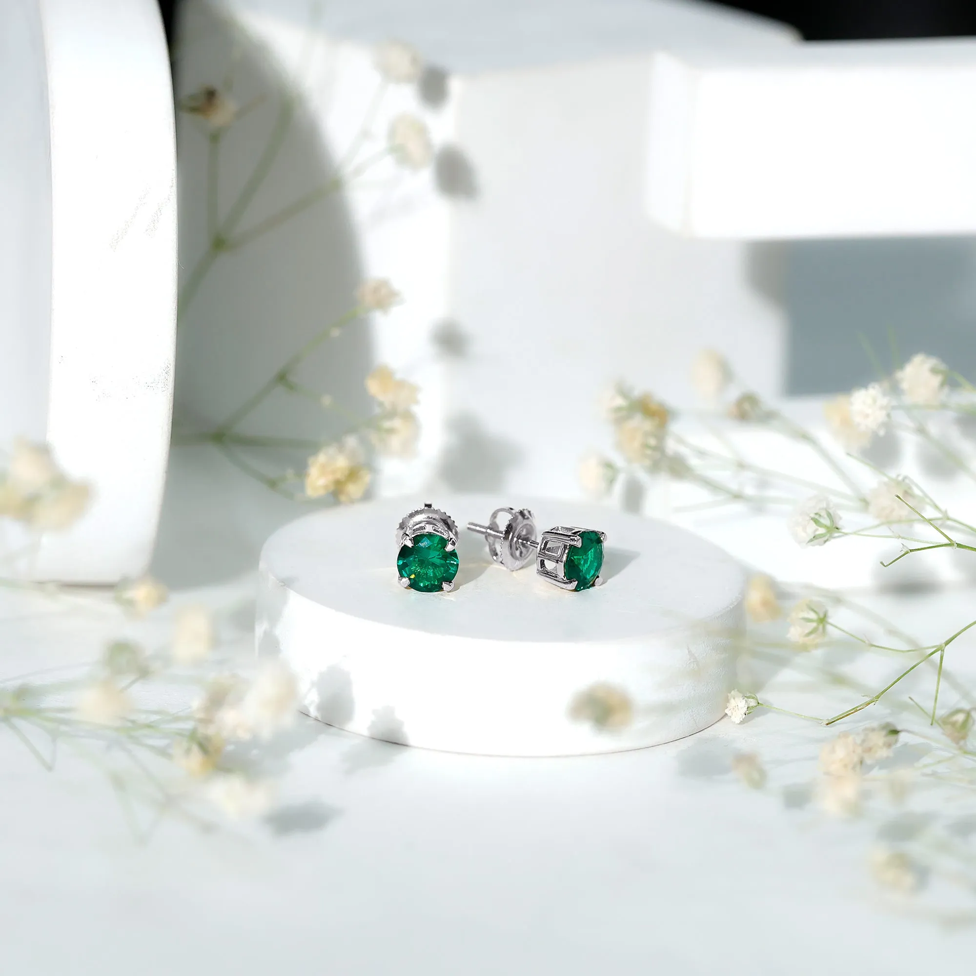 Elegant Created Emerald Solitaire Stud Earrings in Gold